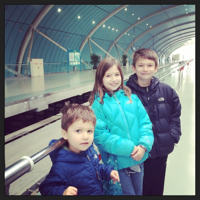Waiting for the Maglev train to arrive. (notice the purse)