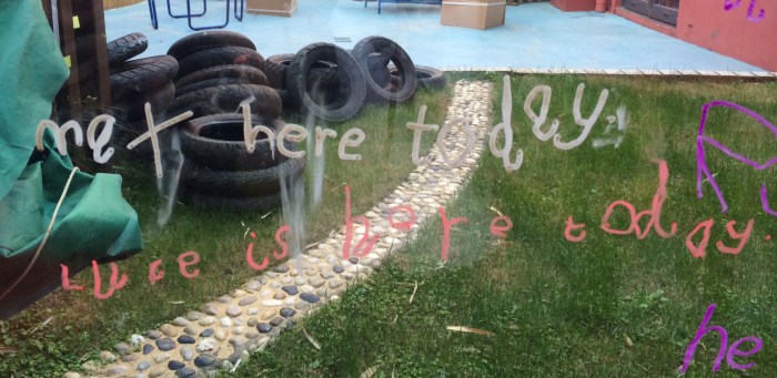 Luke has to sign in everyday at school using window markers. "Luke is here today."