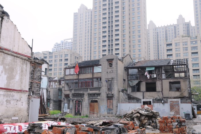 With its future looming overhead, a few occupants hold their ground.