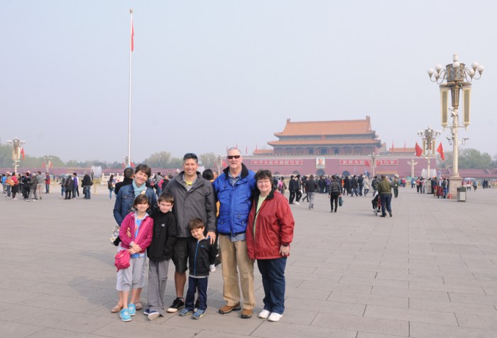 A large portrait of Mao Zedong can be seen in the background above the entrance into the Imperial City Gate.