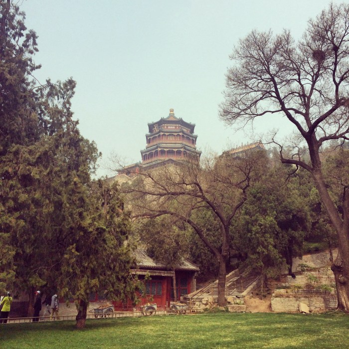 Traditional halls, pavilions, temples, and gardens surround a beautiful lake.