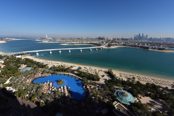 The panoramic Dubai view from Atlantis including the distant Burj Khalifa, Al Arab Hotel, and Palm Jumeirah. 