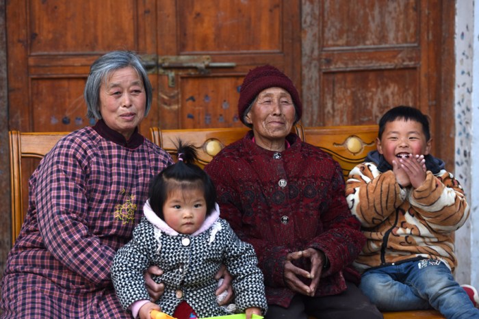 With Grandma and Great-Grandma. Despite all odds, such a loving and happy family.