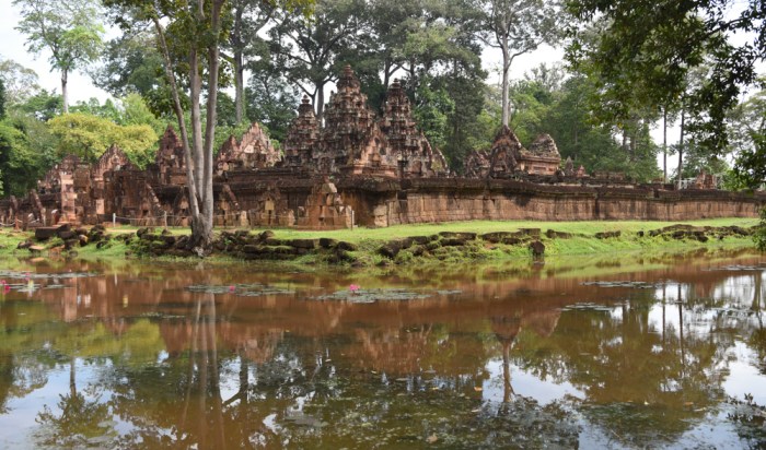 A lotus-filled moat surrounds Banteay Srei.